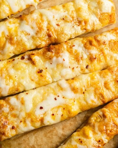 Pumpkin cheesy bread on parchment paper.
