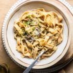 Creamy mushroom ragu in a bowl with a fork.