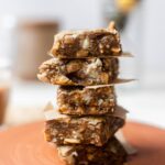 Stack of cardamom blondies on a plate.