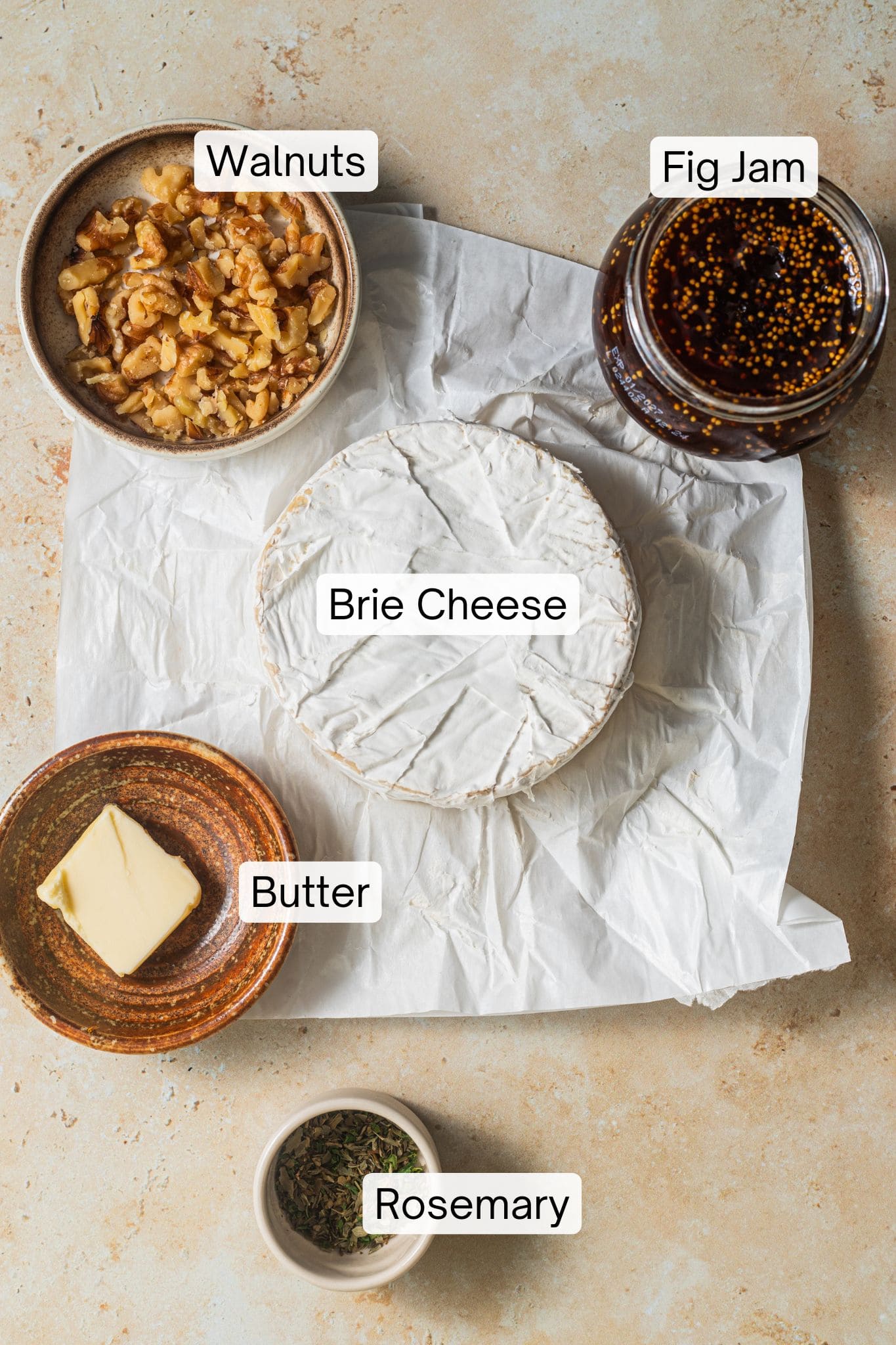 Ingredients laid out to make baked brie in fig jam.