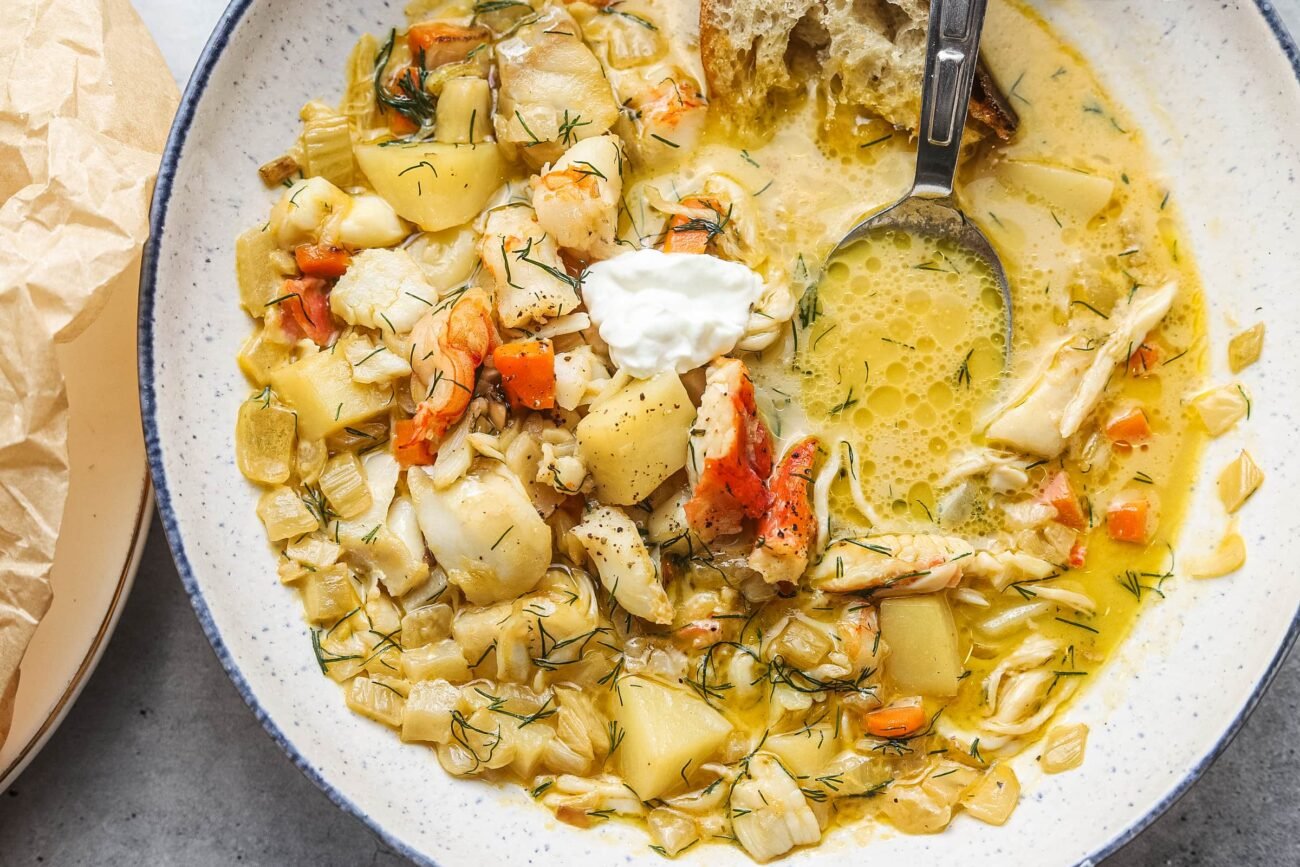 Overhead shot of crab stew with homemade stock, shrimp, fish, and a creamy finish