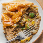 A serving of vegetarian lentil pot pie on a plate.