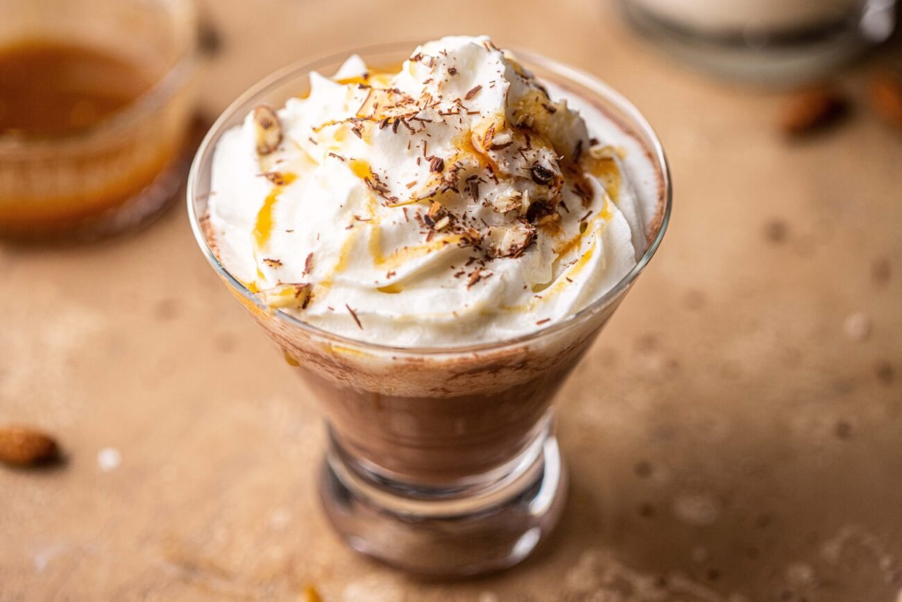 close-up shot of hot chocolate with amaretto and whipped cream