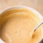 Smash burger sauce in a ceramic bowl with a spoon.