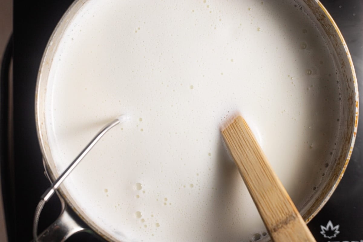 Simmering milk in a pot.