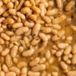 Italian white beans in a brothy mixture with spices.