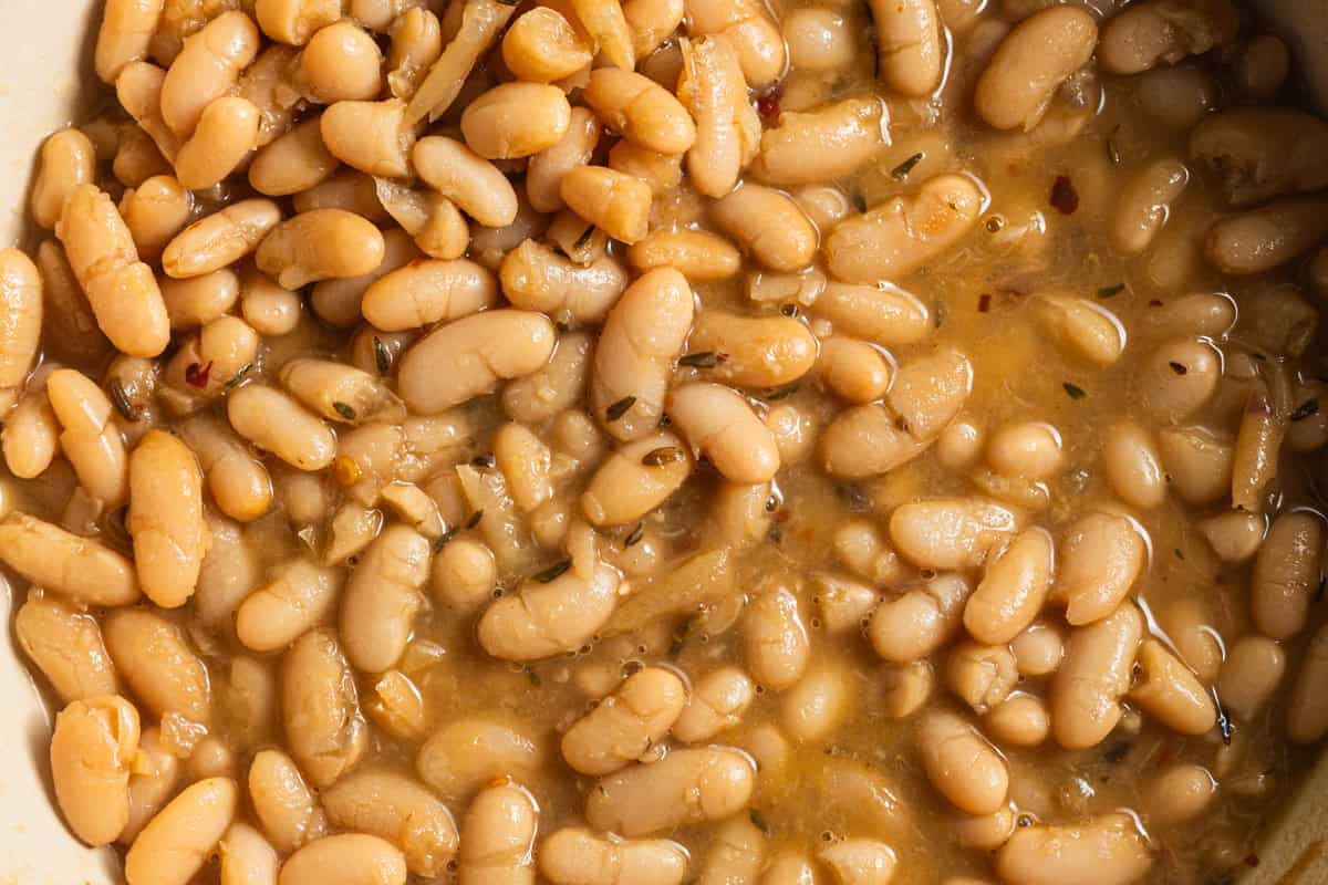 Italian white beans in a brothy mixture with spices.