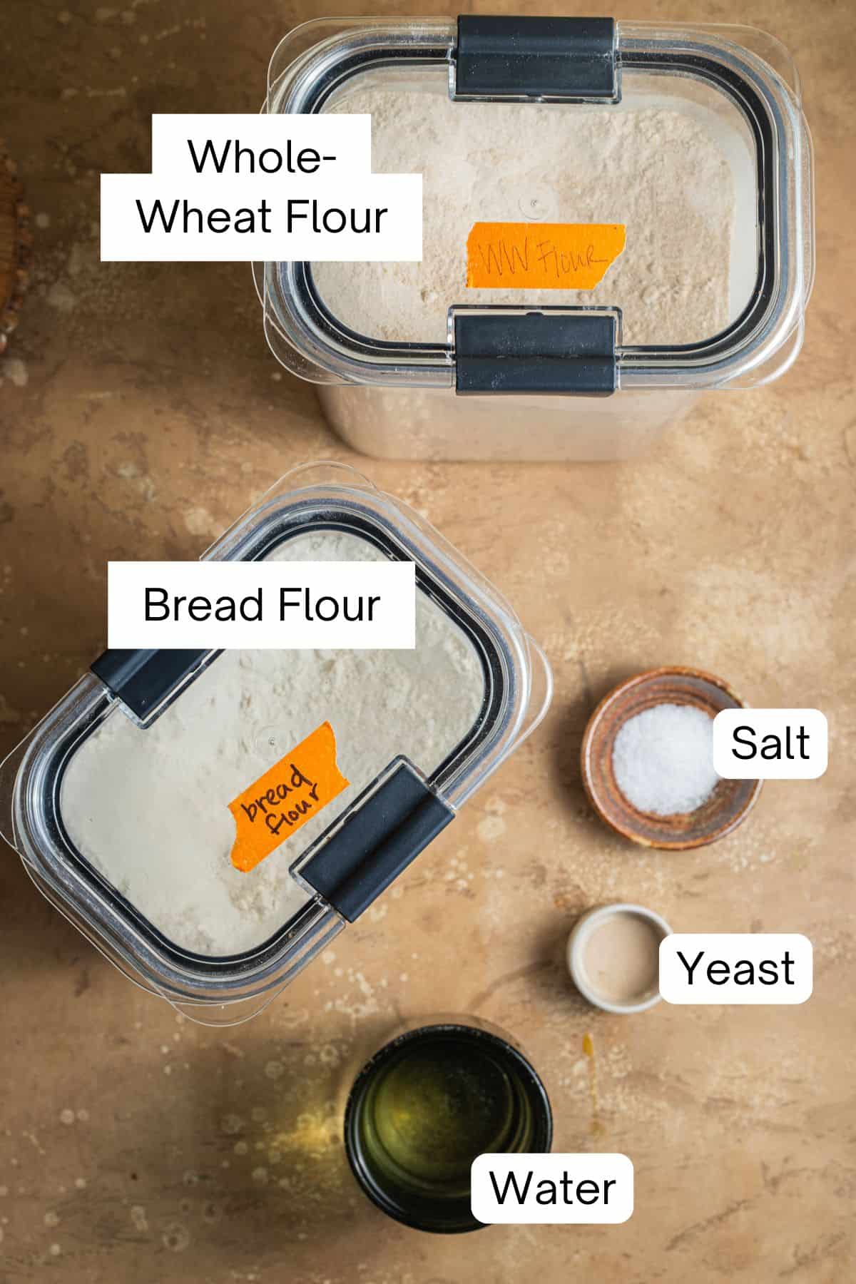 Ingredient laid out to make a whole-wheat Dutch oven bread.