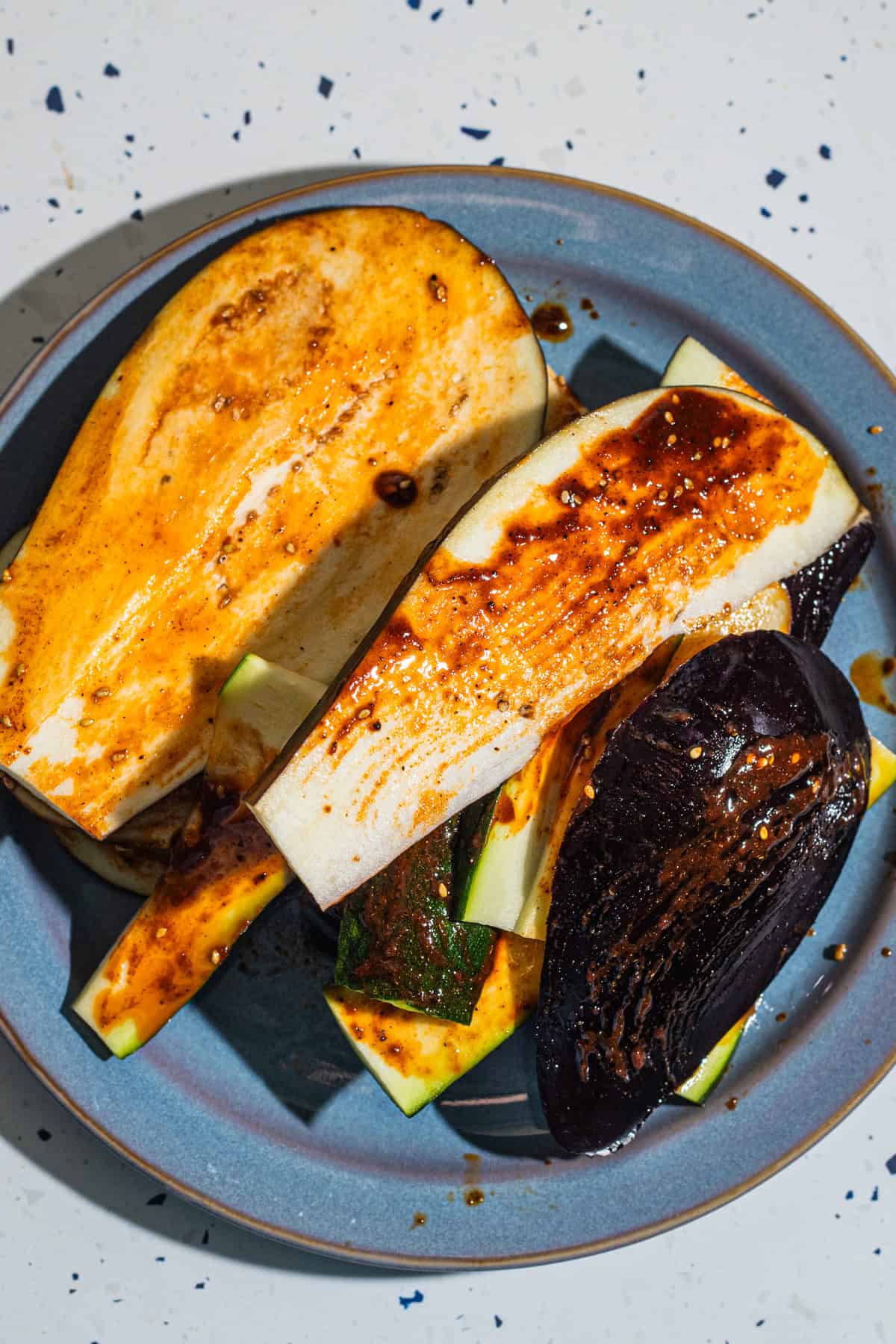 Eggplant and zucchini slices coated in a gochujag glaze.